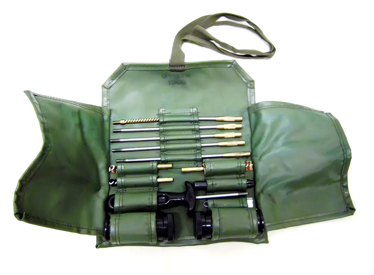 Firearm cleaning kit with rods, brushes and oil