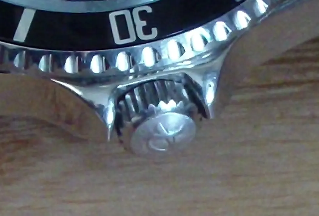 Close-up of the winding crown on a mechanical watch