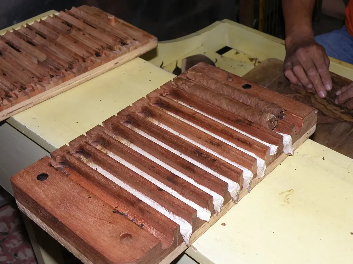Wooden cigar molds holding freshly bunched cigars in a factory in Estelí, Nicaragua