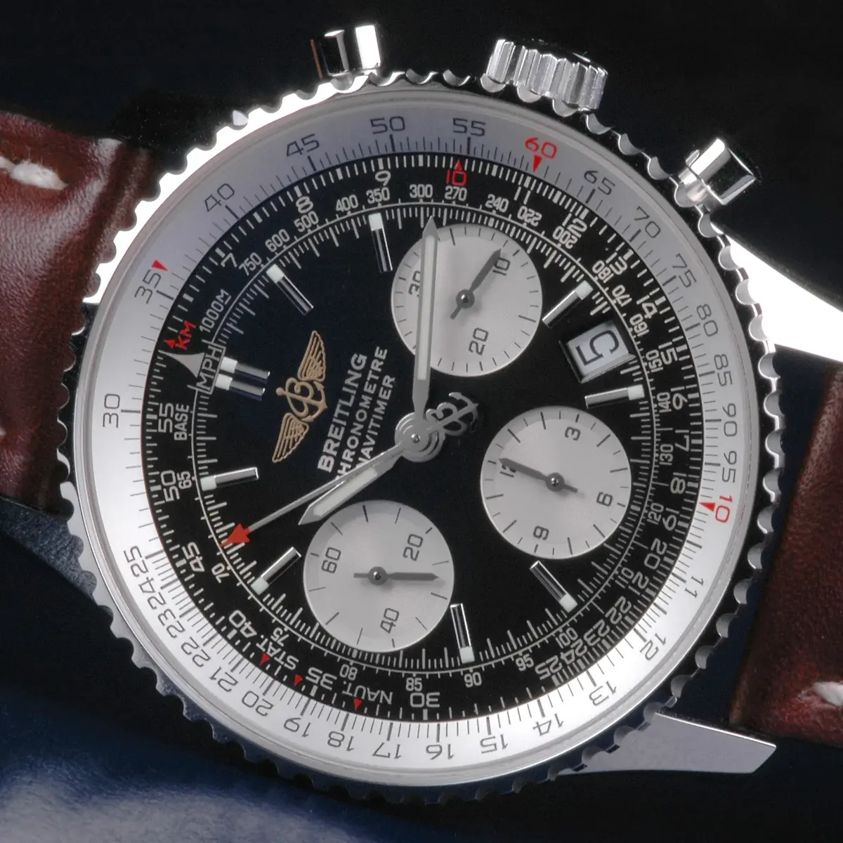 The circular slide-rule bezel of a Breitling Navitimer