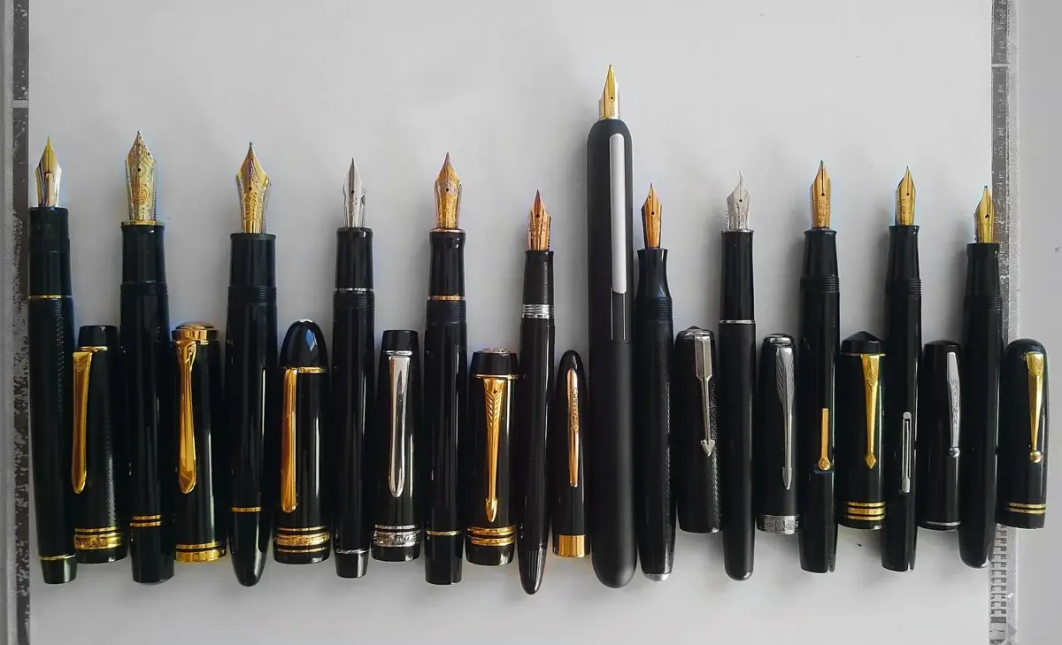 A row of different fountain pens