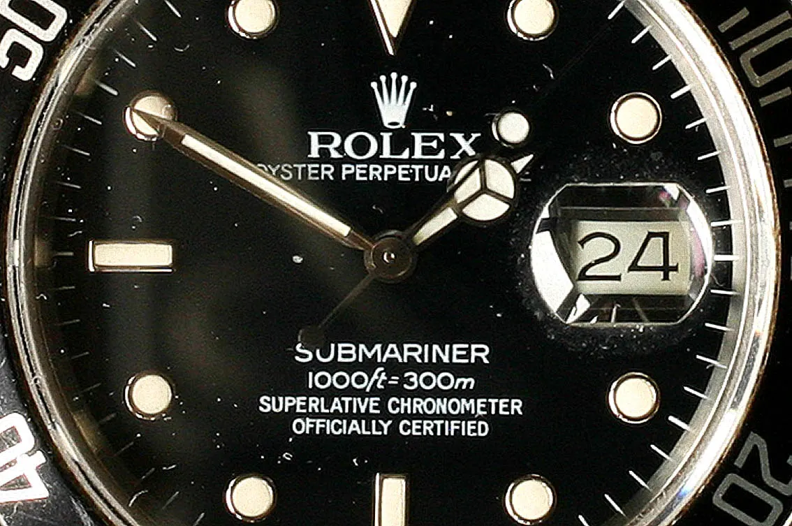 Dial of a Rolex Submariner rated to 300 meters